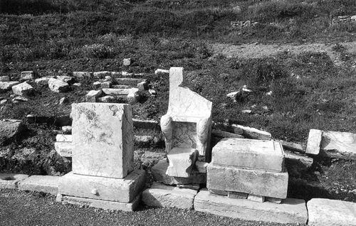 Fig. 4. Messene. The base of the honorific portrait of the generous agonothetes Sophon beside the marble throne of prohedria (photo by the author).
