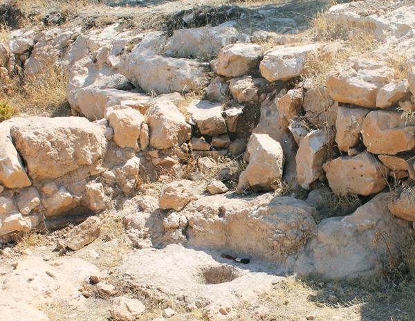 Example of a mortar carved in bedrock inside a structure at Khirbet Qeiyafa.