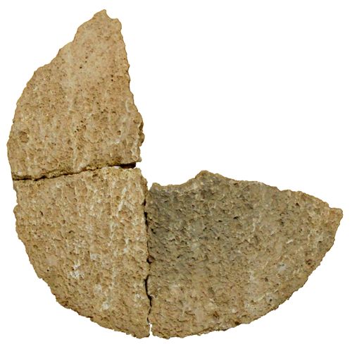 Calcirudite lower stone of rotary mill n°16 (diameter 49 cm) indicating the coarse properties of the rock (photo: Guillermo Tortajada).